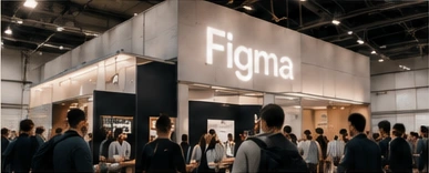 Figma conference booth with an illuminated sign